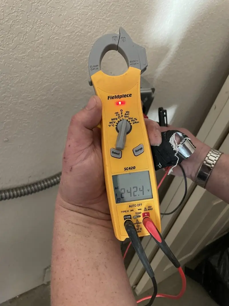 Voltage testing with clamp meter during Electrical Installation Services in Wolfeboro